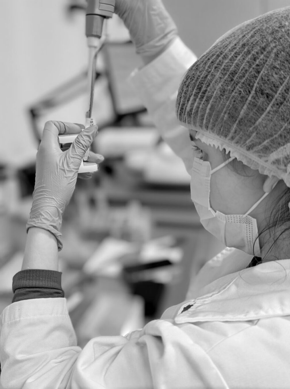 A Granatum scientist pipetting samples in the laboratory.